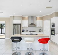 Central Gold Coast Large Modern Elevated Home - Accommodation Nelson Bay